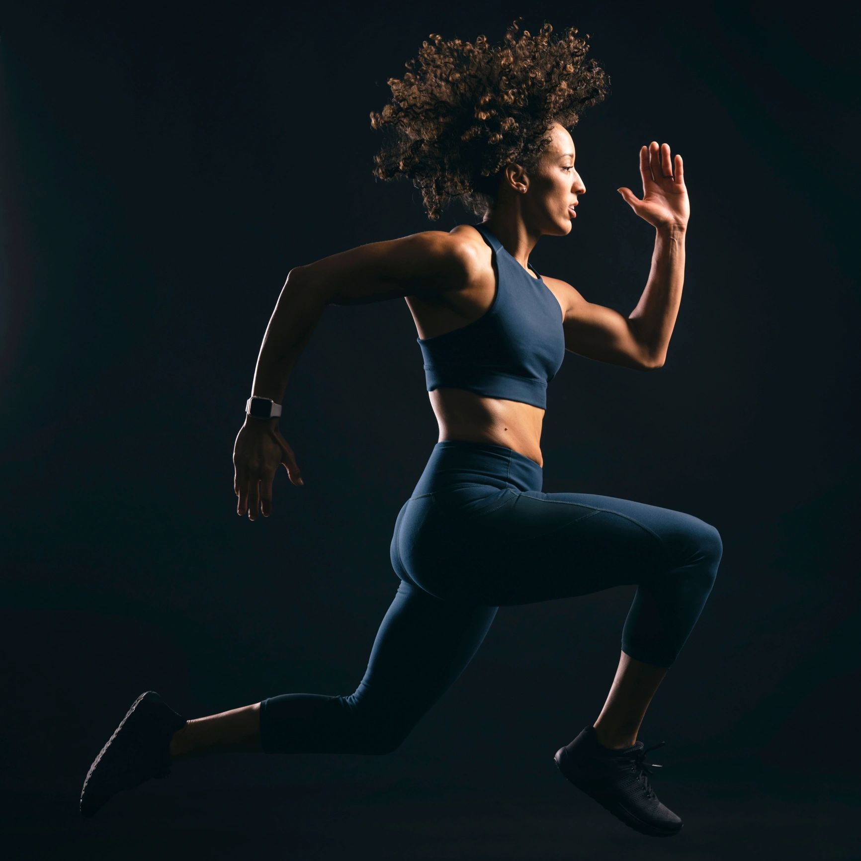 Woman moving dynamically during a fitness workout