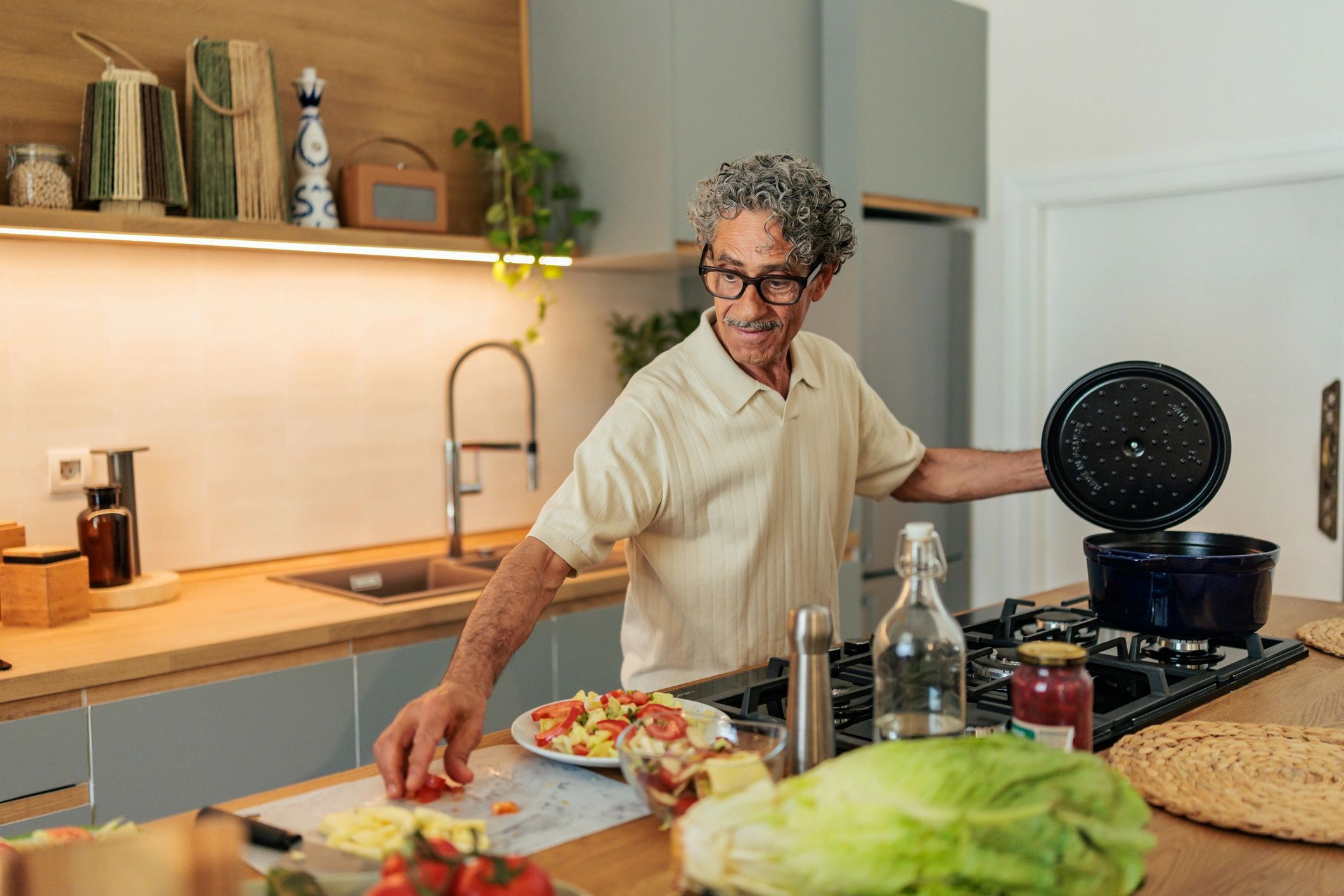 Older adult preparing fresh vegetables at home